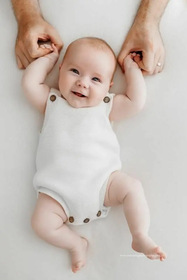 Newborn holding a hands of an adult. Nano Banana prompt example